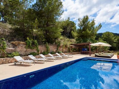 View of pool and sunbeds photo - Casa Kiva: 6 bedroom child friendly luxury villa with infinity pool in Es Cubells, Ibiza